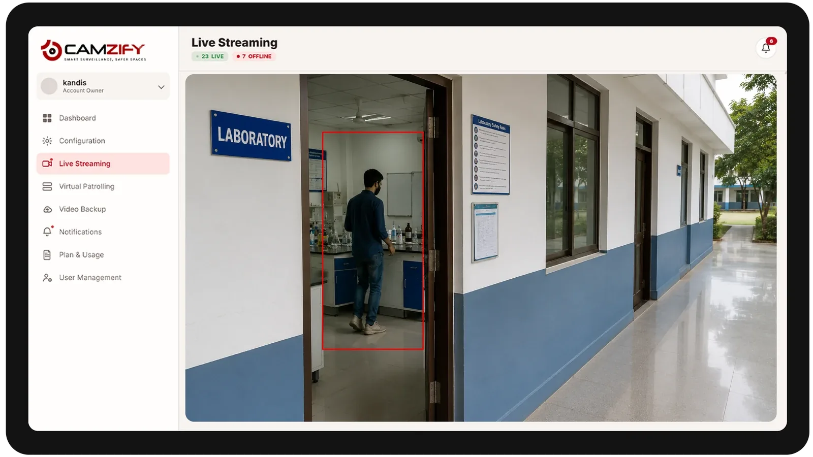 Live streaming from a education facility camera with people and vehicles outlined as they are tracked